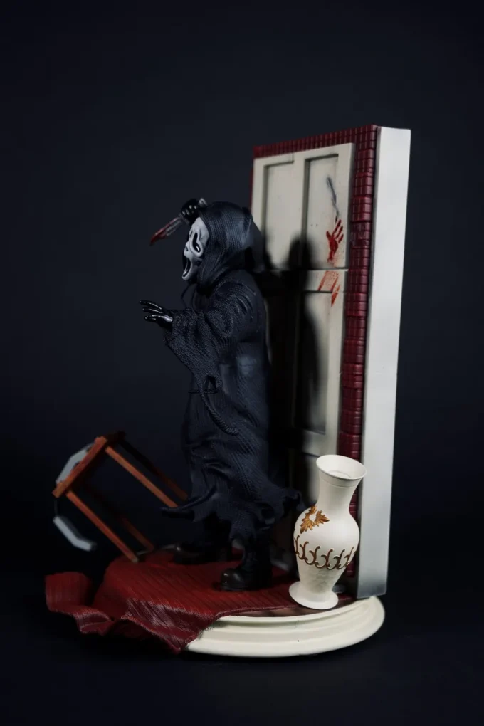 Ghostface figure from Scream with knife, mask, and horror diorama base.