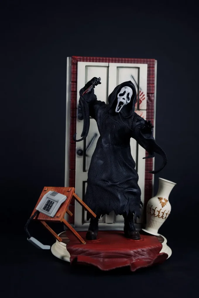 Ghostface figure from Scream with knife, mask, and horror diorama base.