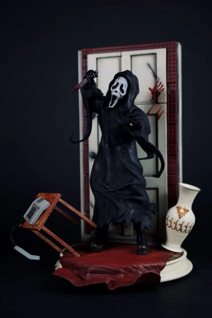 Ghostface figure from Scream with knife, mask, and horror diorama base.