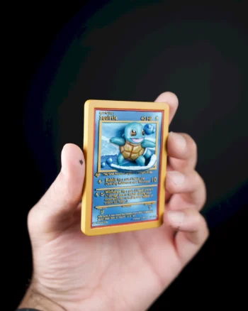 3D Squirtle Pokémon card magnet with water splashes bursting from the card.