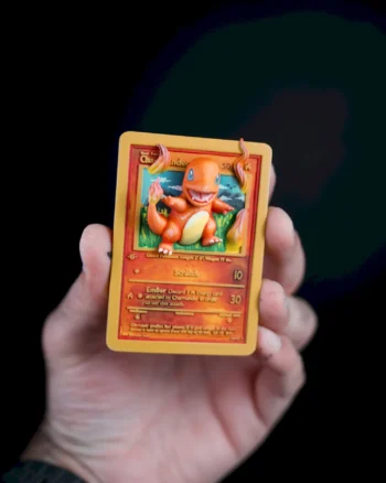 3D Charmander Pokémon card magnet with flames bursting from the card.