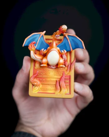 3D Charizard Pokémon card magnet with wings spread and flames bursting from the card.